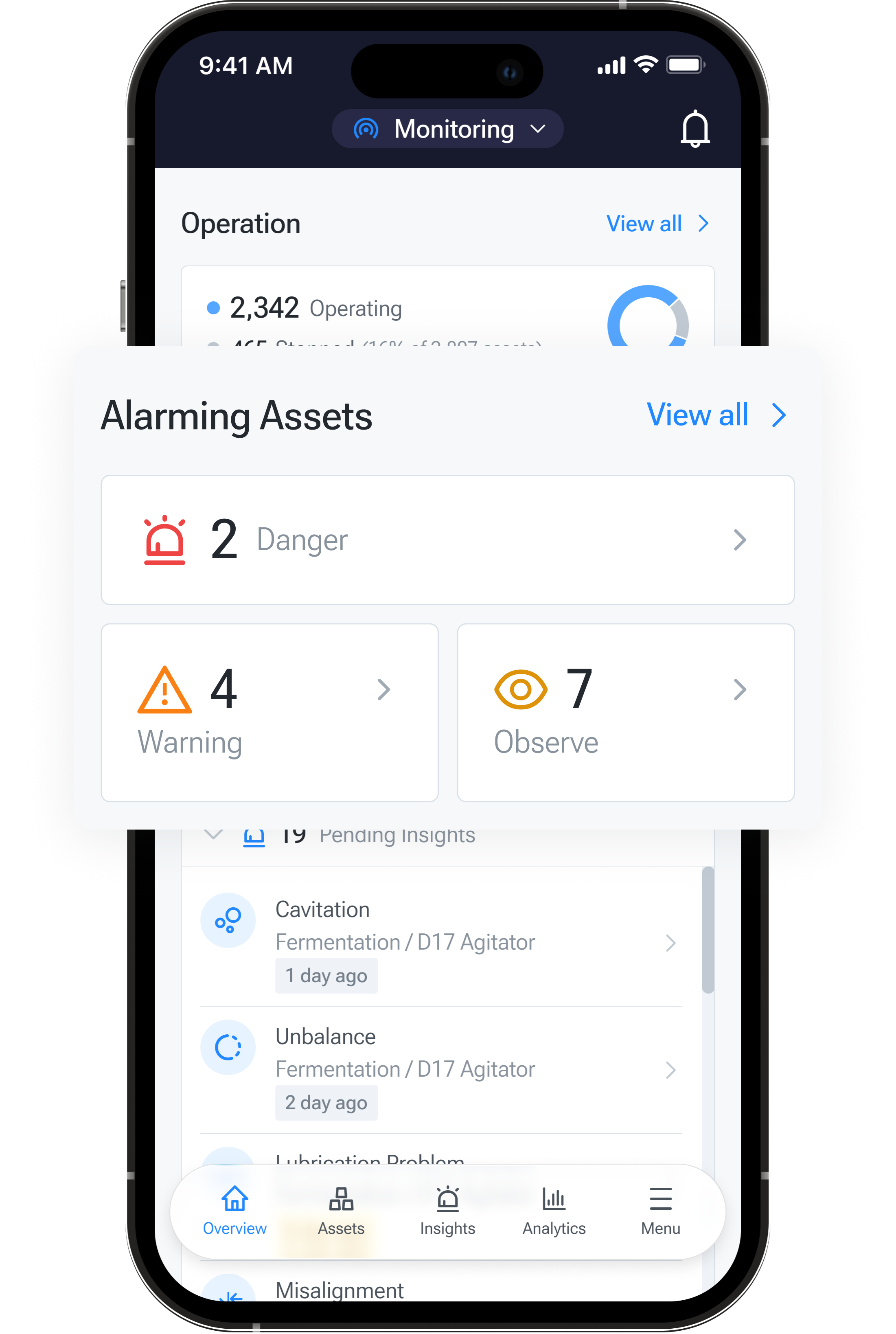 Tractian mobile prototype showing the Alarming Assets panel